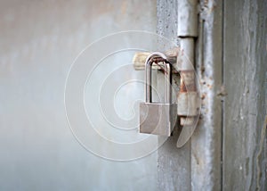 Close up old door locked with chain and padlock.