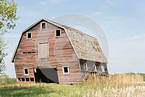 Close up of an old faded red barn