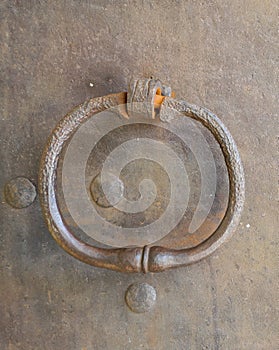 A close-up of an old-fashioned door knocker