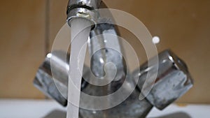 Close up old and grunge faucet and water drop. Close-up of old rusty faucet from which water flows