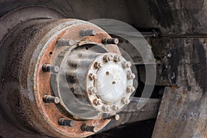 Close up of old hub wheel car. Rust on hub wheel. Rear wheel