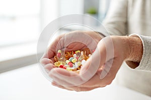 Close up of old man hands holding medicine