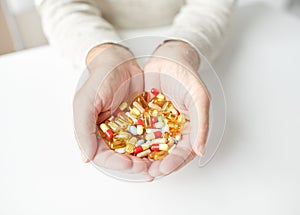 Close up of old man hands holding medicine