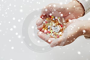 Close up of old man hands holding medicine