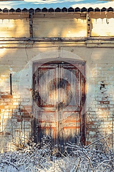 Close up old paint peeling door of abandoned building exterior concept photo