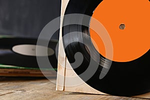 close up of old records on wooden table