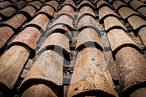 Close-up of old roof of a house made of clay tiles