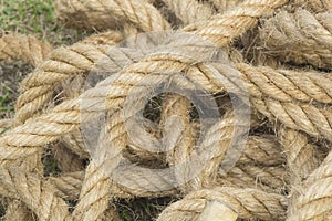 Close-up of an old rope as a grass background, rope cluster