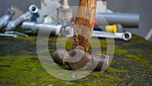 Close up of old and rusted hammers on a rock