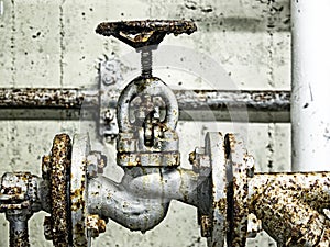 Close-up of an old rusted shut-off valve