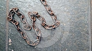 Close up of old rusty iron chain