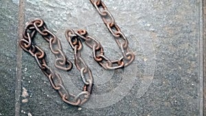 Close up of old rusty iron chain