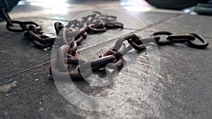 Close up of old rusty iron chain