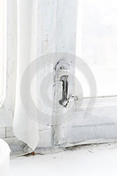 close up of old rusty metal fence gate pad lock latch. old brown wooden gate