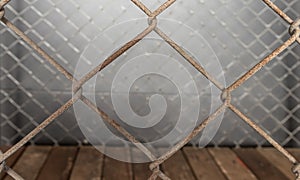 Close up of old rusty metal wire mesh cage texture