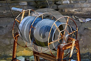 Close-up of old rusty reel cable