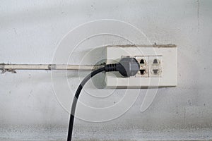 Close-up of old socket, electrical outlet with plug