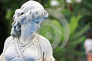 Close-up Old statue abandoned in a garden, portrait inspirations