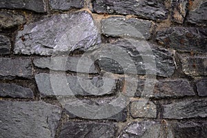 A close up of an old stone wall