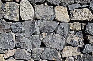 Close up of old stone wall texture. Architecture vintage brick background