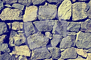 Close up of old stone wall texture. Architecture vintage brick background.