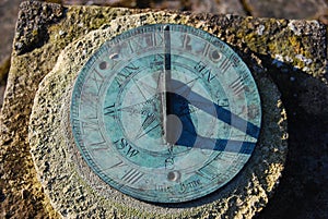 Close up of old sundial with shadow