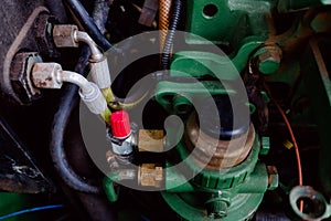Close-up of an old tractor engine with cooling pipes