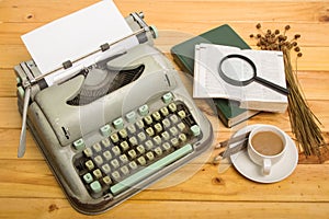 Close-up of an old typewriter with paper