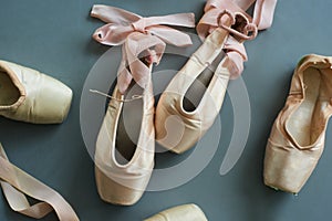 Close up old used ballet pointe shoes.