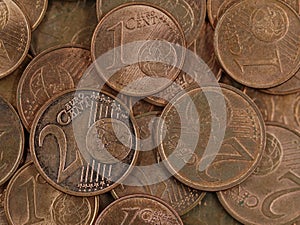 Close up of old used one and two euro cent coins background, end of small change or cash