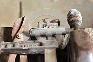 Close up of old used rusty tools on wooden table