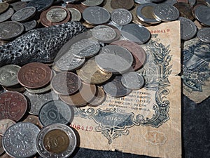 close up of old vintage coins with silver bar and old Soviet banknote