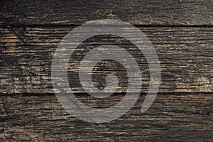 Close-up old vintage dark rough hardwood natural wooden surface background. Empty oak plank wood abstract backdrop