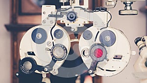 Eye sight vision test machine measurement with vintage and retro photo effect. photo