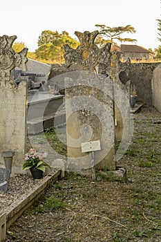 Close-up of an old, weather-worn gravestone in a cemetery