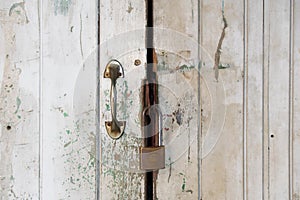 Close up Old white door and master key lock