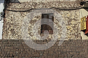 Close up of old window of a house facade in Cuzco Peru. Historical downtown