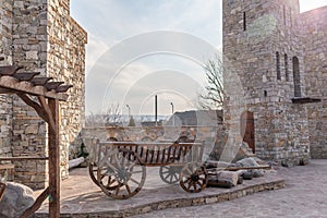 Close-up of an old wooden cart made from logs, used to transport goods