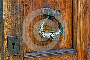 Close up of old wooden door handle in ortodox church