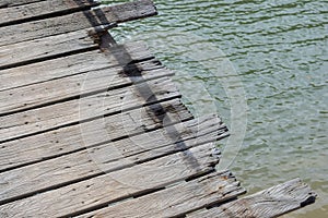 Close up of the old wooden pier in Thailand with copy space