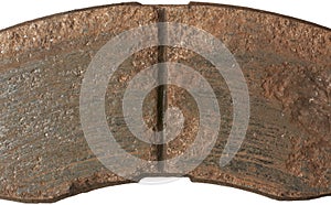 close-up of old worn out car disc brake pad surface