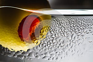 Close-up of olive with pepper in a martini glass with drops photo