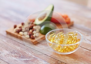 Close up of omega 3 capsules and food on table photo