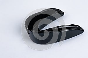 A black gumshield on a white background