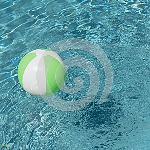 Close-up one bright green beach ball in swimming pool sunny day