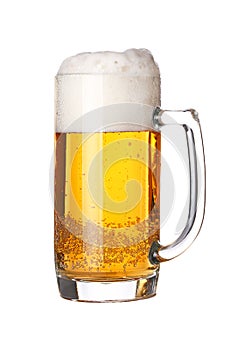 Close up one frothy beer glass isolated on white