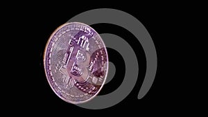 Close up, One Gold Bitcoin Coin Floating in Blank Space on a Black Background