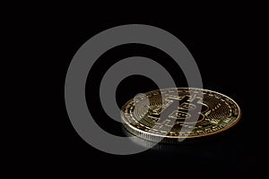 Close up one golden coin with bitcoin symbol on black background. Cryptocurrency, Money coins digital. Blockchain technology,