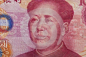 Close up of one hundred Yuan banknote with focus on portrait of Chinese statesman Mao Tse-tung