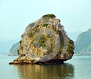 Close up of one of the limestone karsts in the sunshine, Halong Bay Vietnam 